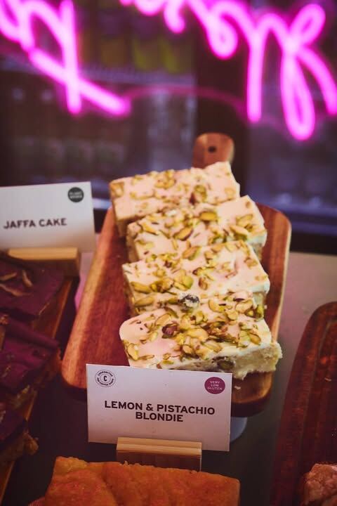 Lemon and pistachio blondies under the pink neon